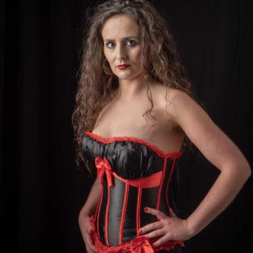 Black and red corset in studio